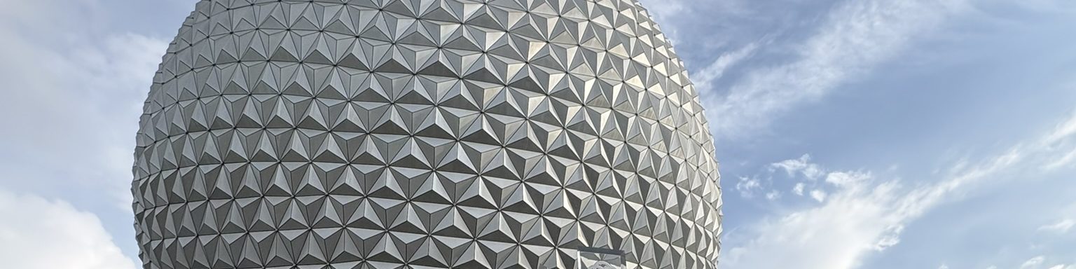 The geodesic sphere at EPCOT, triangular panels against a bright sky